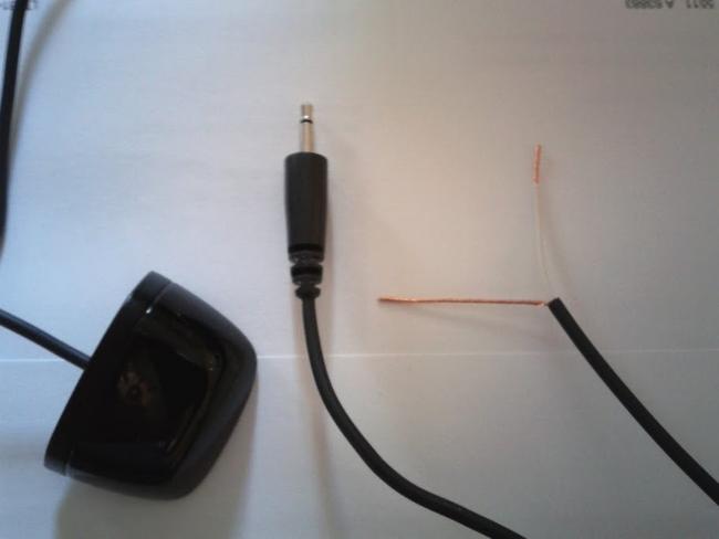 Logitech mini-blaster cut in half with stripped wires